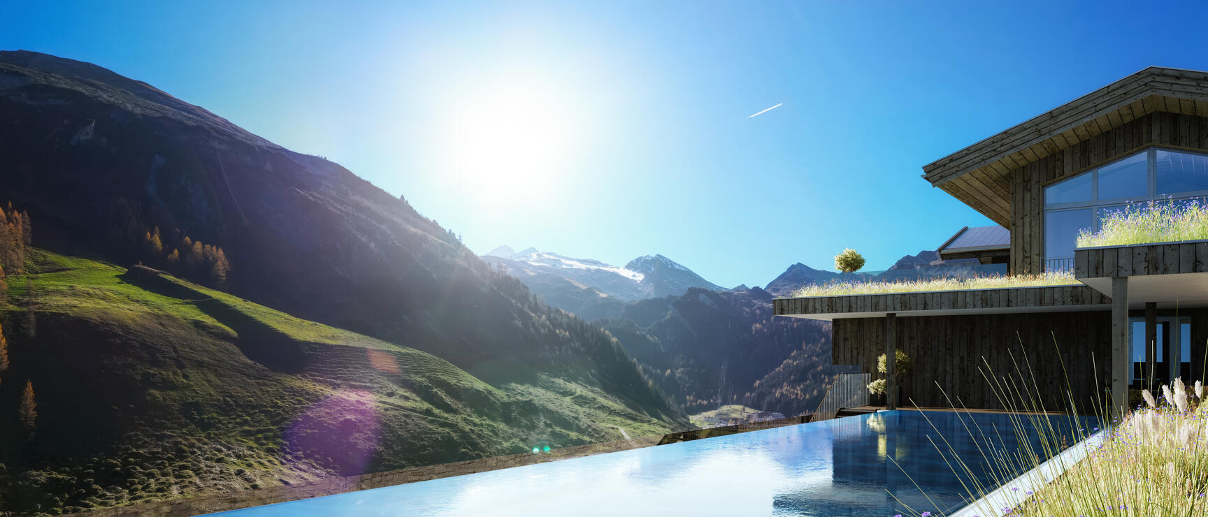 Infinity pool beside modern wooden chalet overlooking snow-capped mountain peaks and green slopes.
