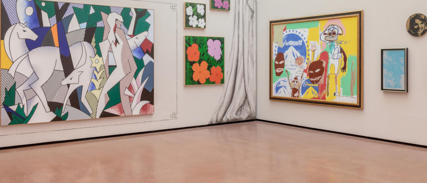 Exhibition room with large-format pop art paintings: horses, flowers and colourful figure scenes on light walls.