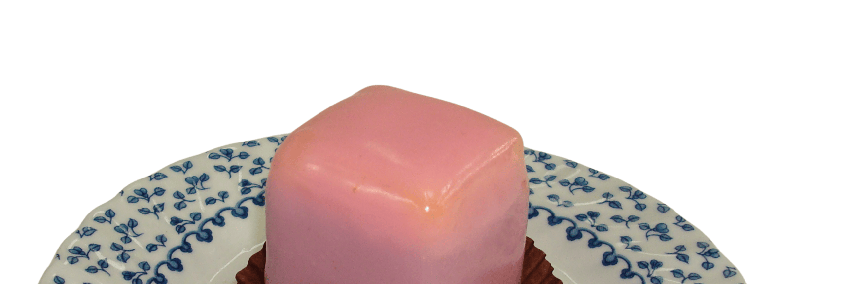 Punch doughnuts from the L. Heiner Court Pastry Shop with pink icing on a blue-and-white patterned porcelain plate