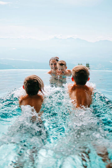 Mountain Resort Feuerberg; family in the water basin