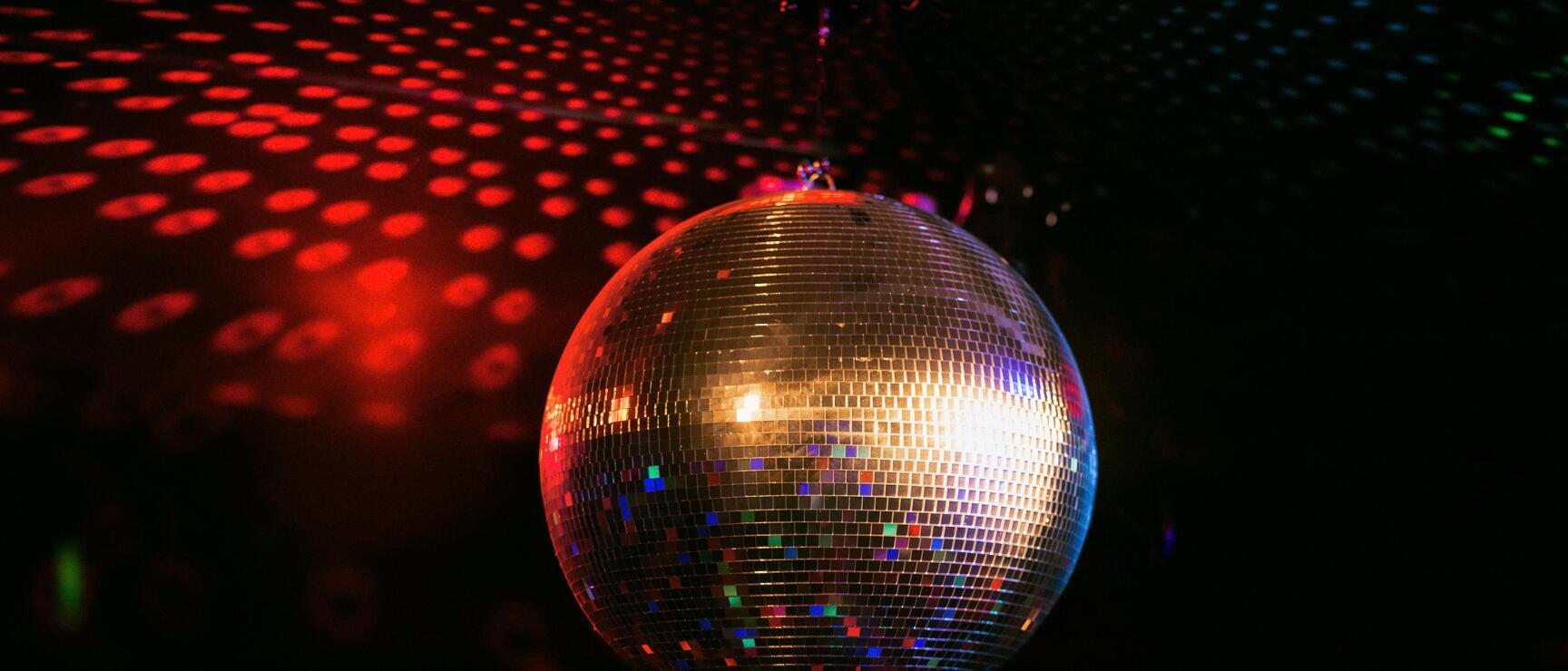 a shimmering disco ball in the dark
