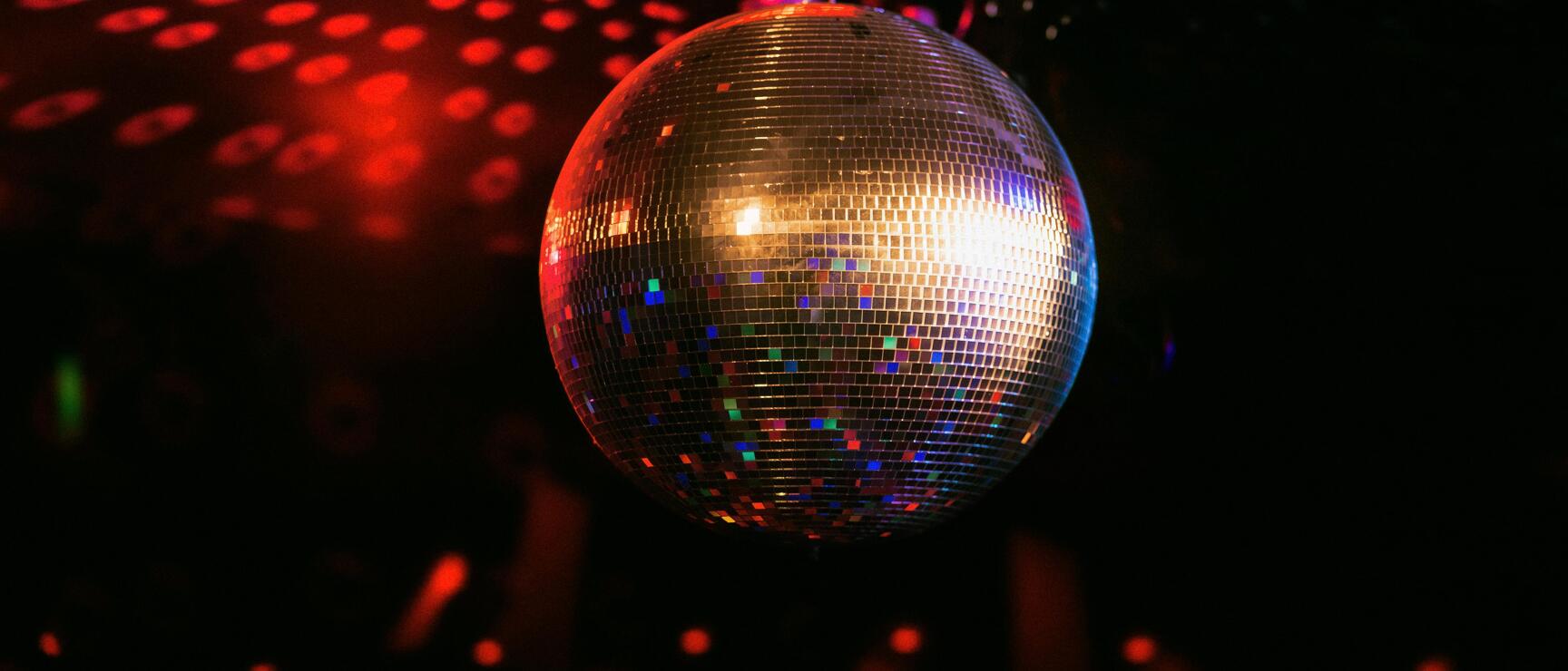 a shimmering disco ball in the dark