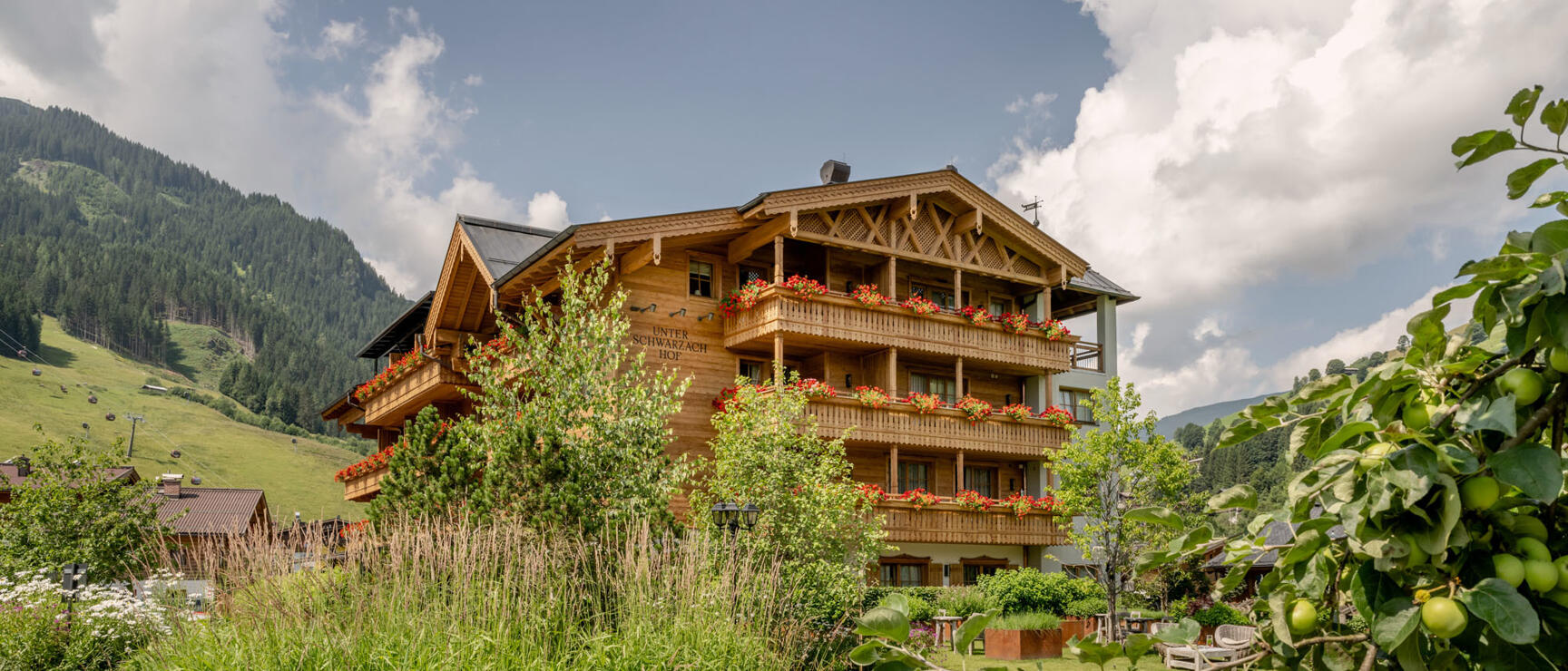 exterior view of unterschwarzachhof in summer - a charming hotel in the austrian alps