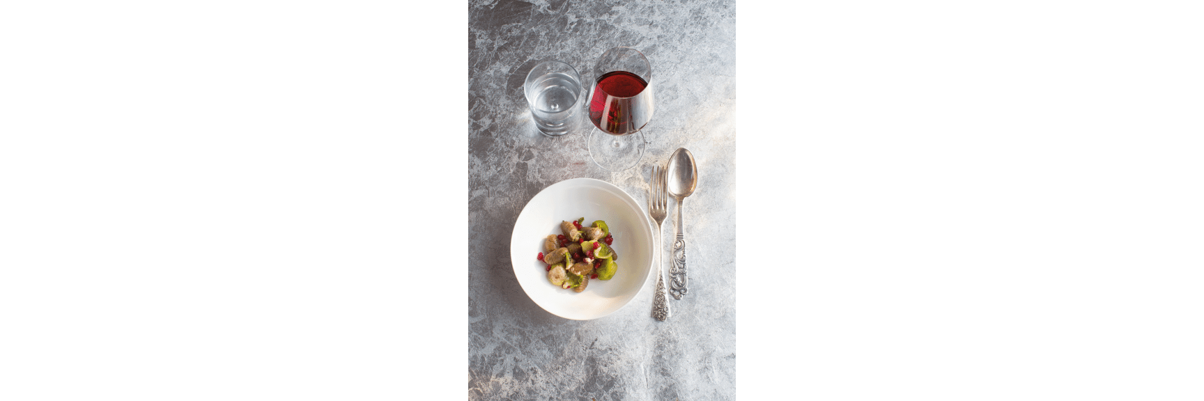 Chestnut gnocchi with cabbage sprouts and pomegranate