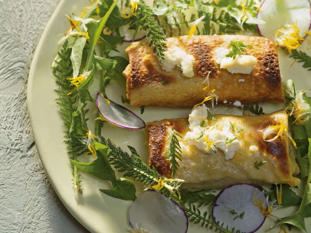 Herb pancakes with feta cheese and dandelion