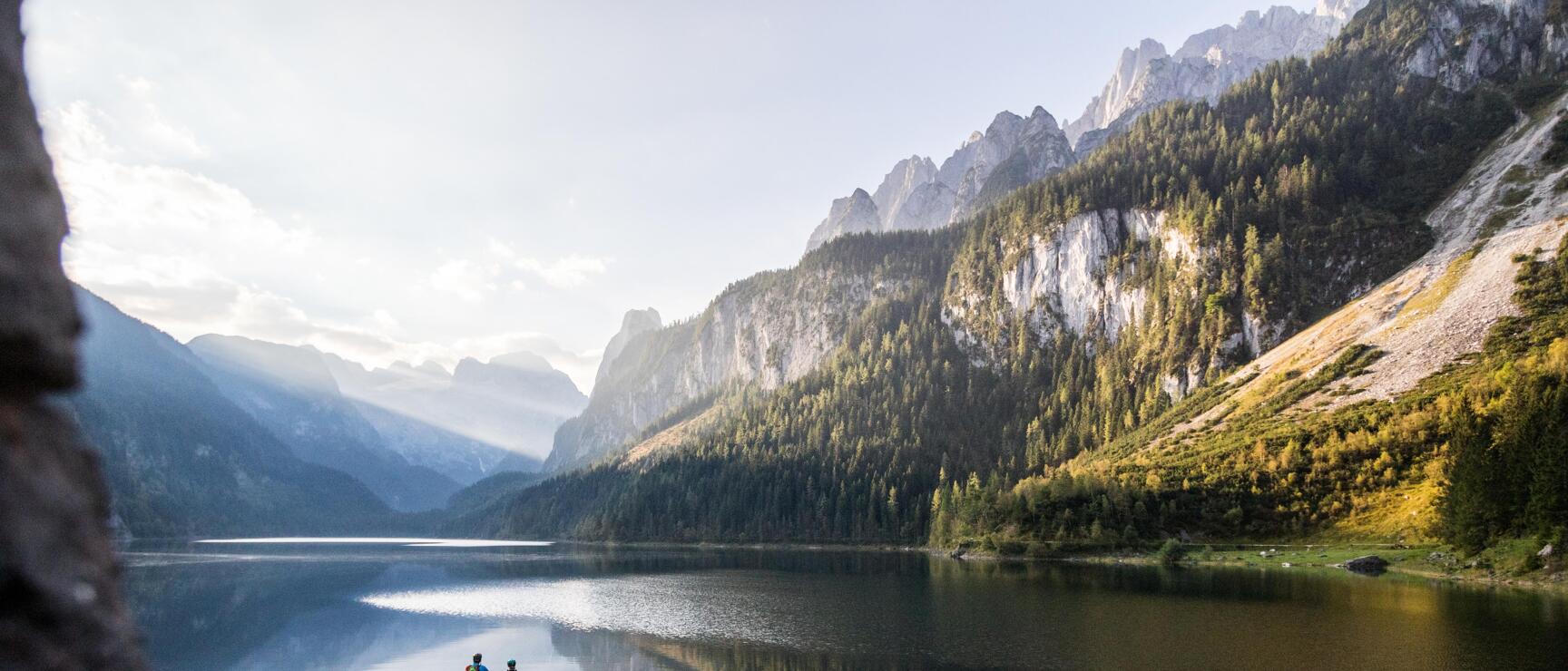 Couple with mountain bikes at the dock on Lake Gosau, Salzkammergut