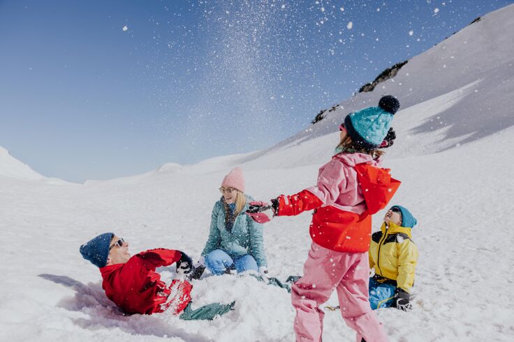 Fun in the snow, family at Krippenstein mountain in Obertraun