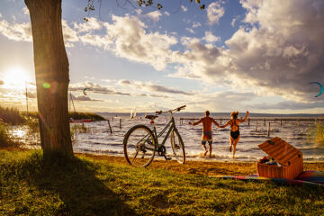 Two cyclists looking for cooling off in Lake Neusiedl